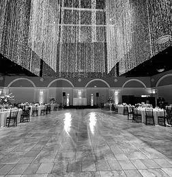 The hall at Casa Real, a curtain of lights hanging over the dance floor and tables set either side