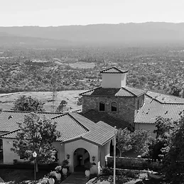 The tiled roofs of the Ranch at Silver Creek from above, with the whole valley spread out behind it